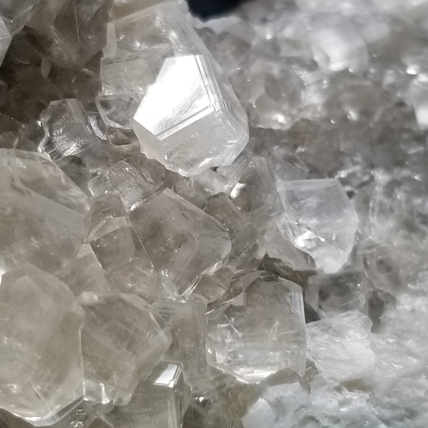 #33000 Clear Nailhead Spar Calcite on Chalcopyrite ore and multiple small fossils in the matrix