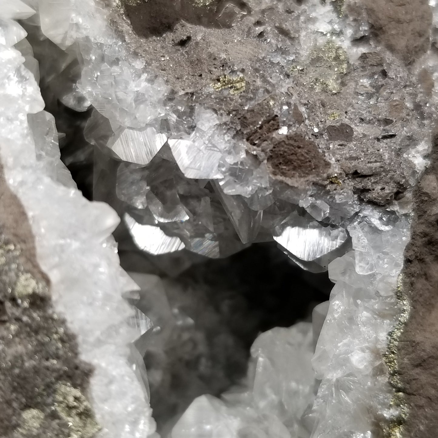 #33008 Super clear Nailhead Spar Calcite geode, Chalcopyrite ore and multiple small fossils in the matrix