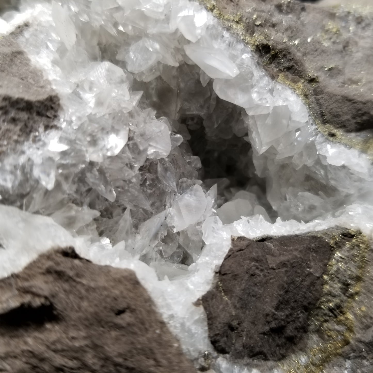 #33009 Super clear Nailhead Spar Calcite geode, Chalcopyrite ore and multiple small fossils in the matrix