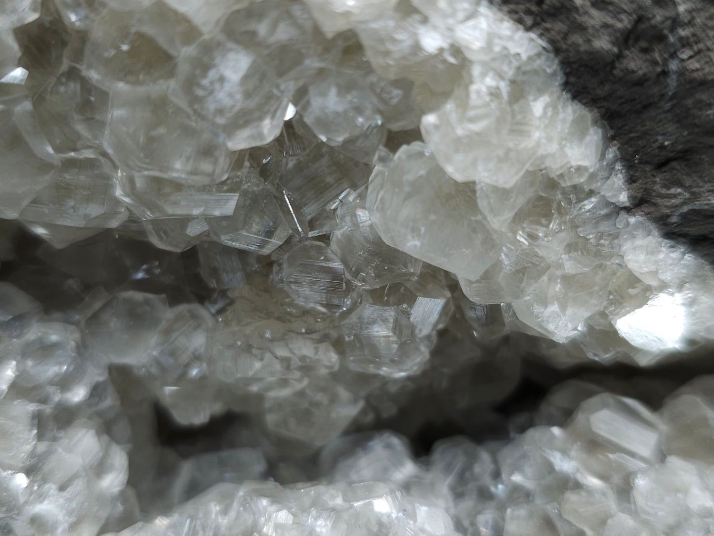 #33107 Super clear Nailhead Spar Calcite geode with Chalcopyrite ore and multiple small fossils in the matrix