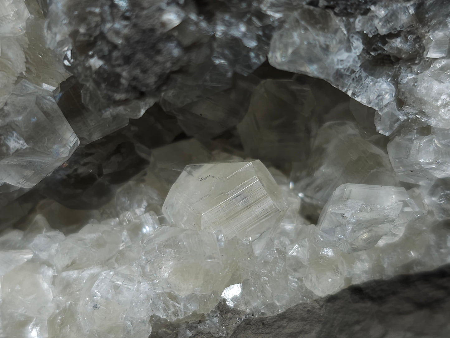 #33078 Super clear Nailhead Spar Calcite geode, Chalcopyrite ore and multiple small fossils in the matrix