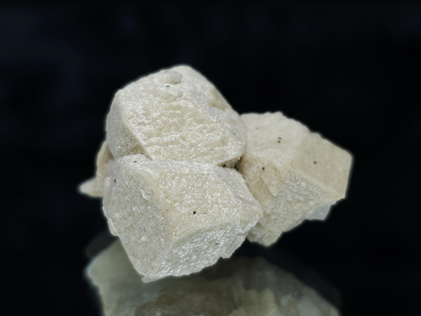 #88024 Hematite on cream-white Calcite pseudomorph after triple Combined form Calcite