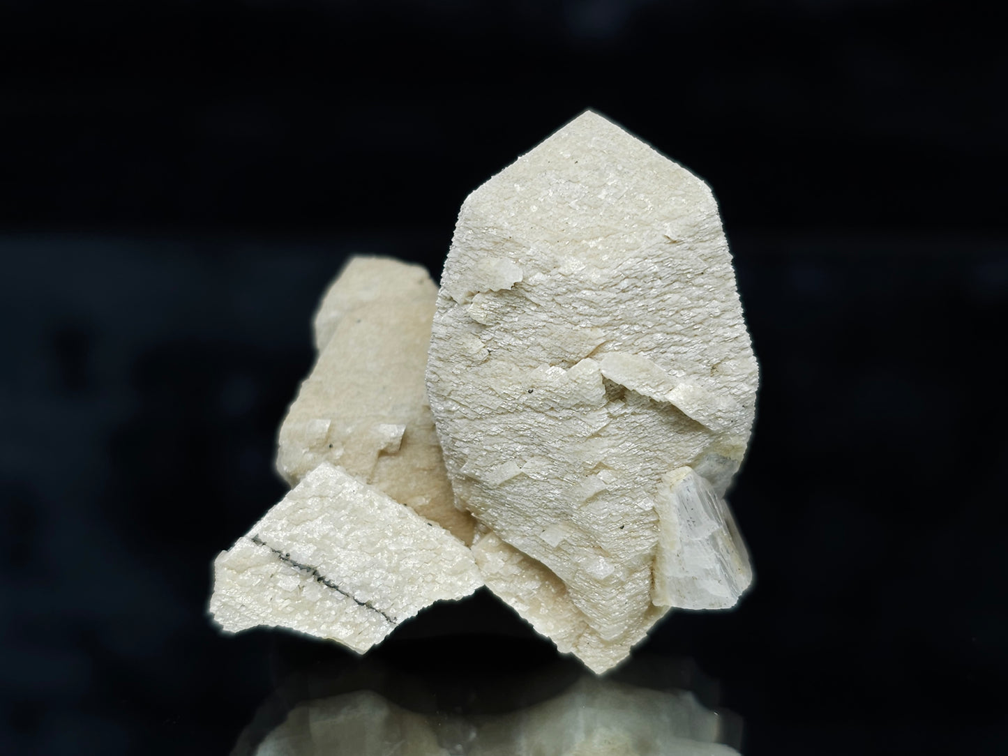#88028 Hematite on cream-white Calcite pseudomorph after twin Combined form Calcite