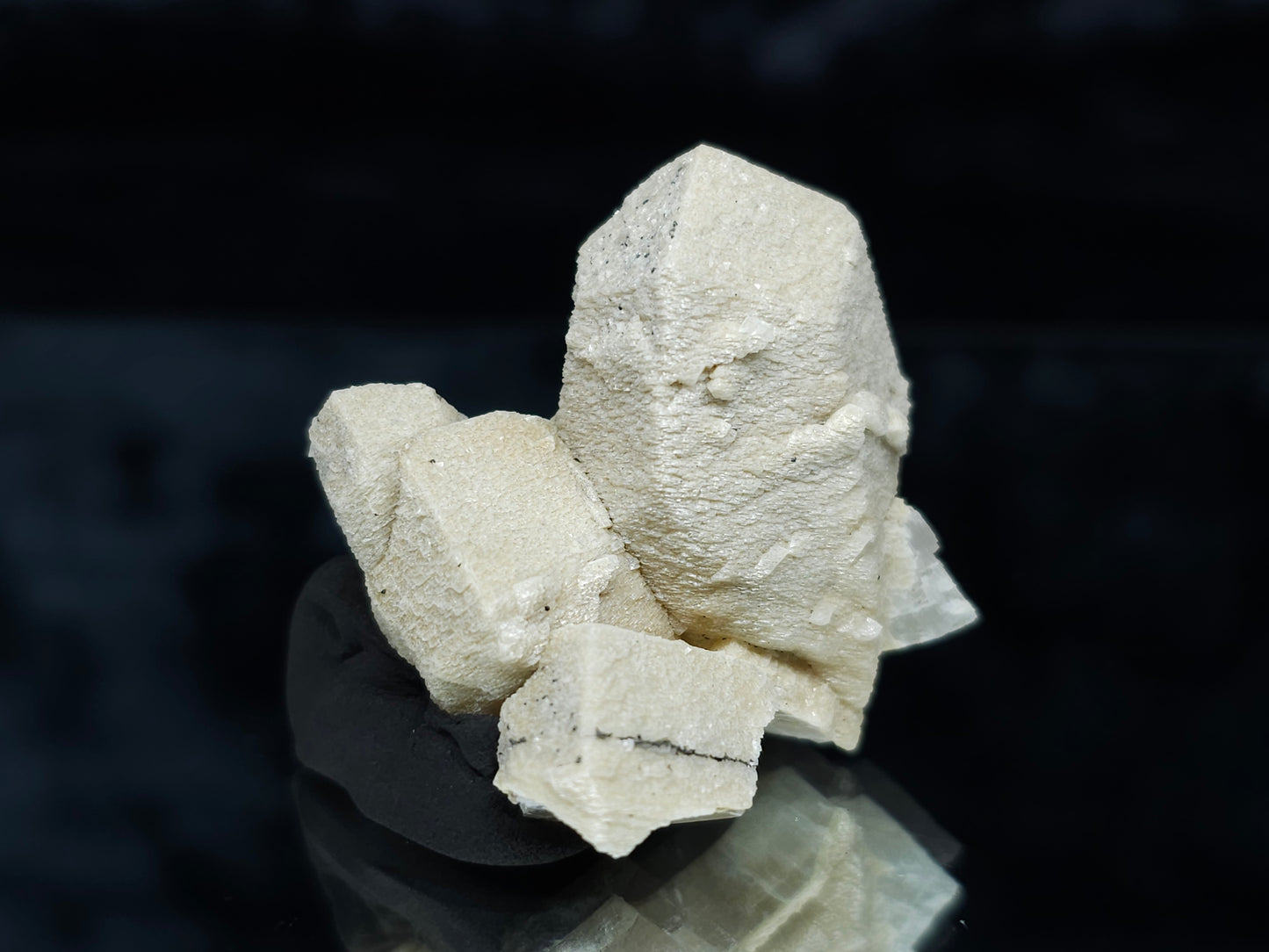 #88028 Hematite on cream-white Calcite pseudomorph after twin Combined form Calcite