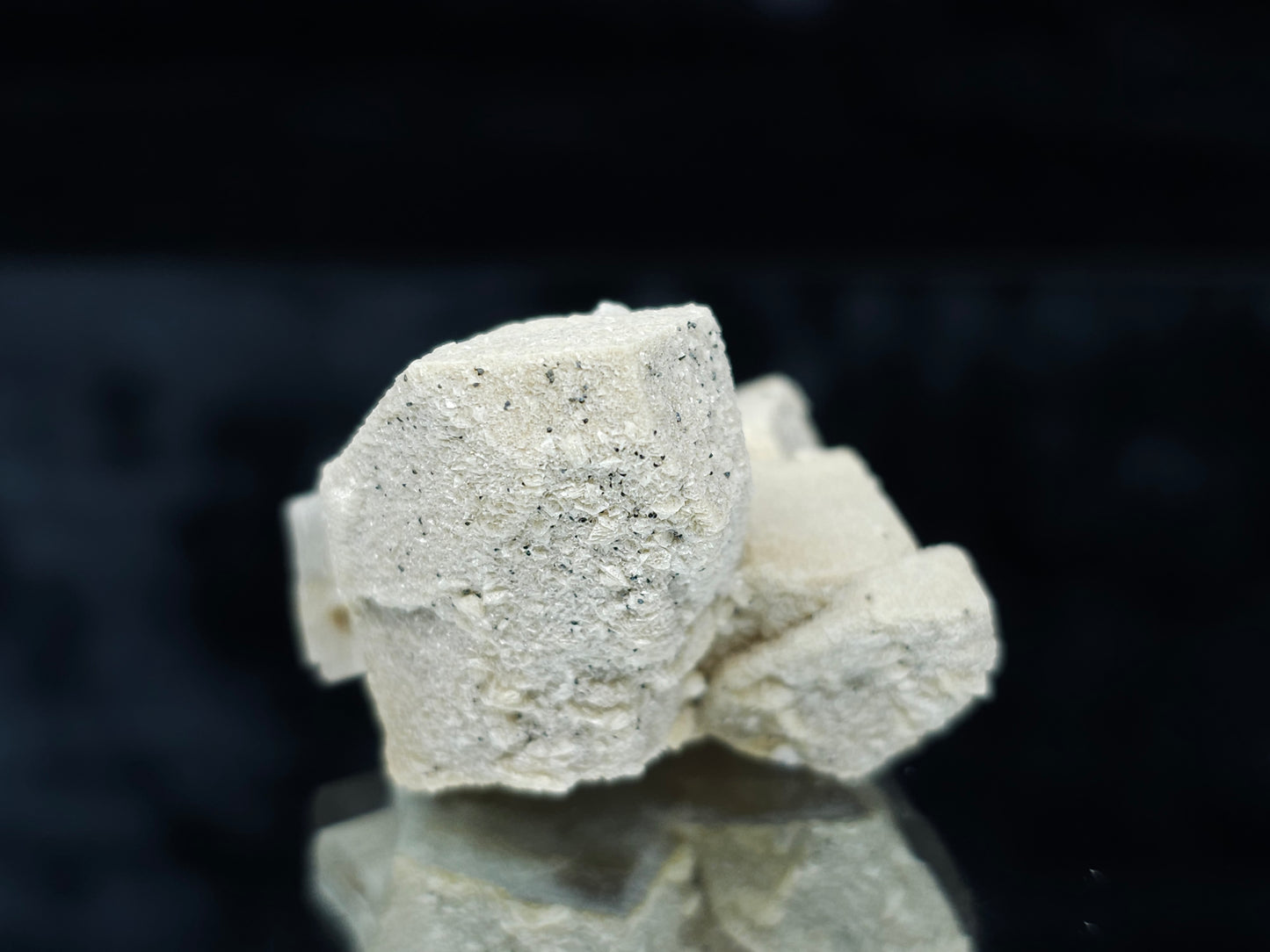 #88028 Hematite on cream-white Calcite pseudomorph after twin Combined form Calcite