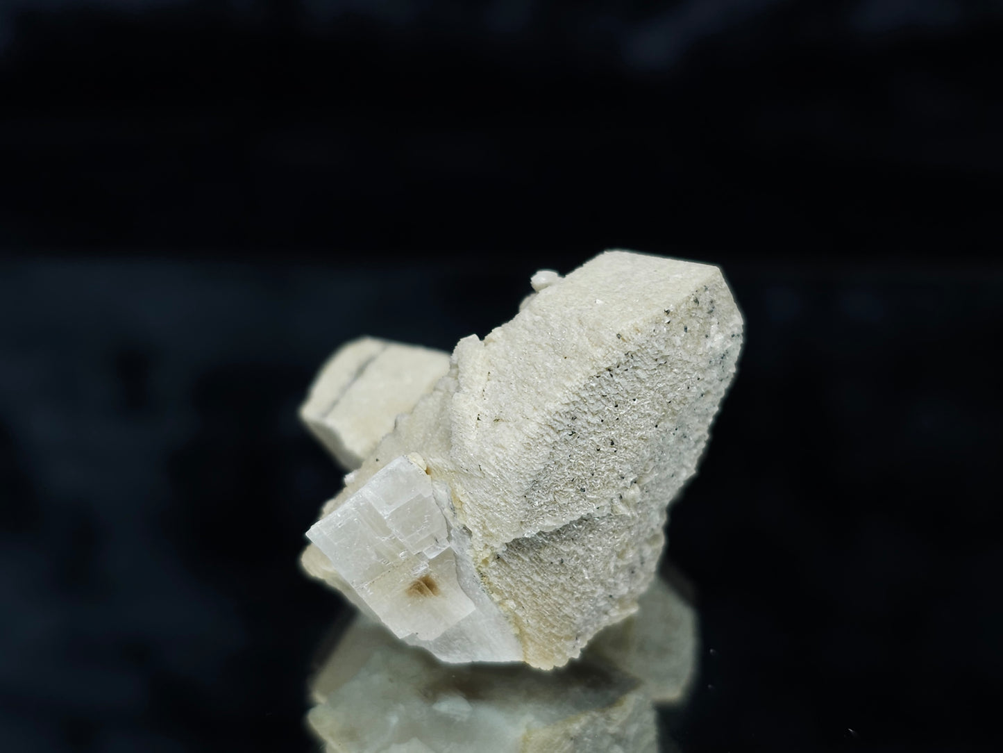 #88028 Hematite on cream-white Calcite pseudomorph after twin Combined form Calcite