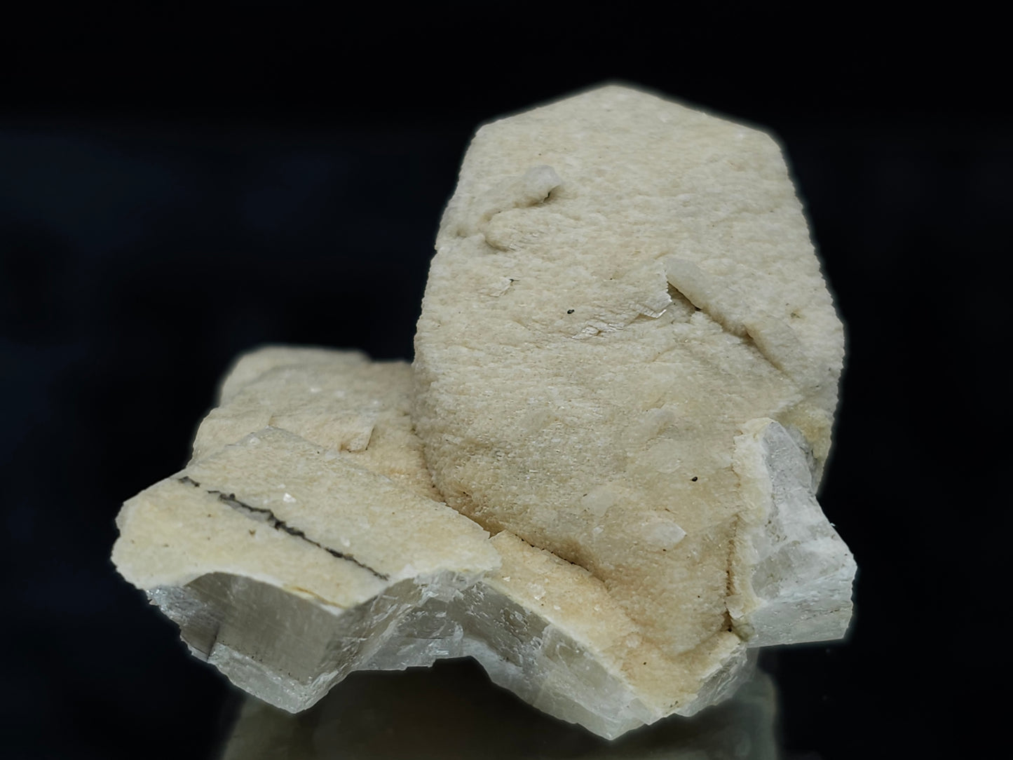 #88028 Hematite on cream-white Calcite pseudomorph after twin Combined form Calcite