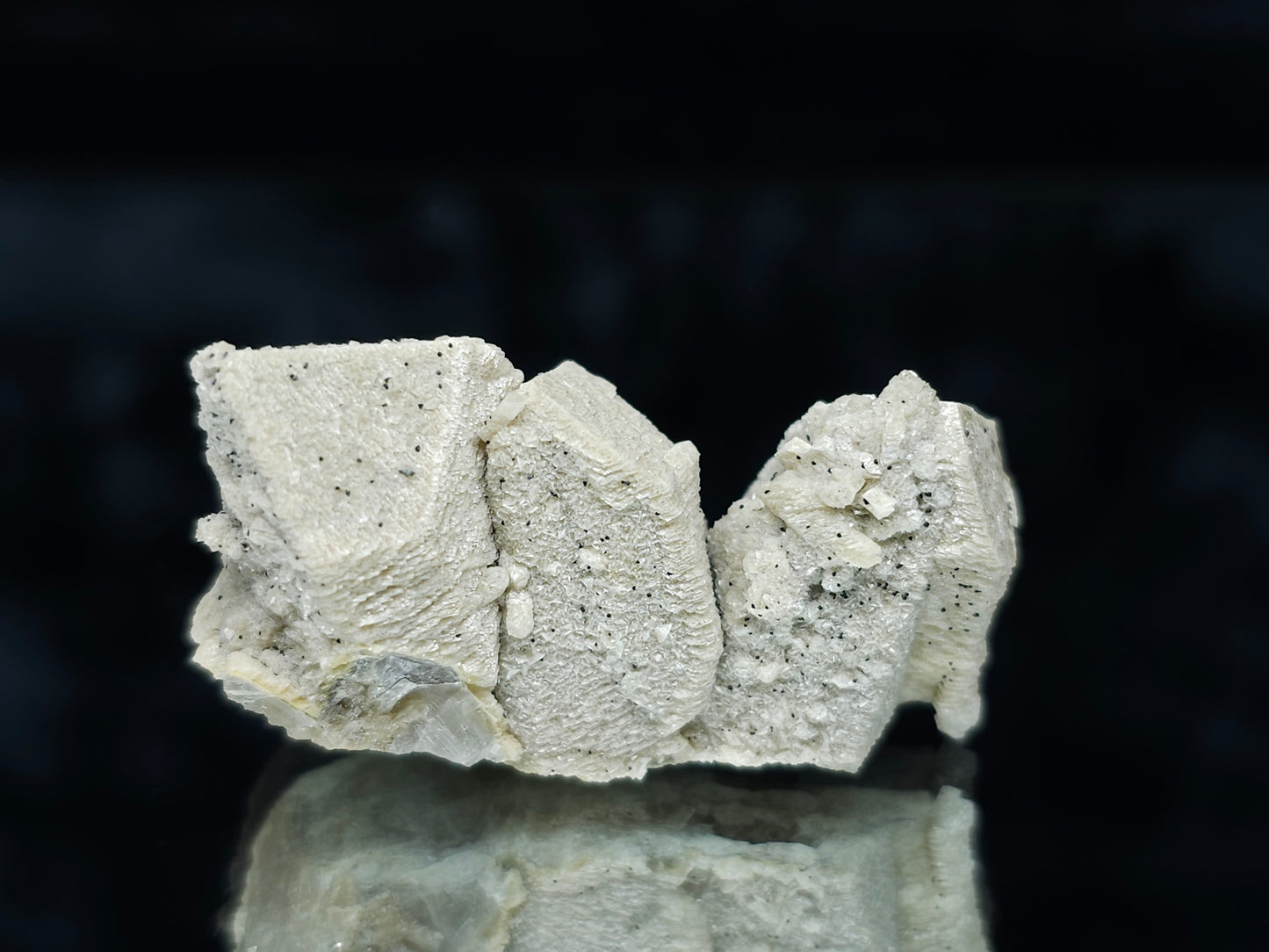 #88032 Hematite on cream-white Calcite pseudomorph after triple Combined form Calcite