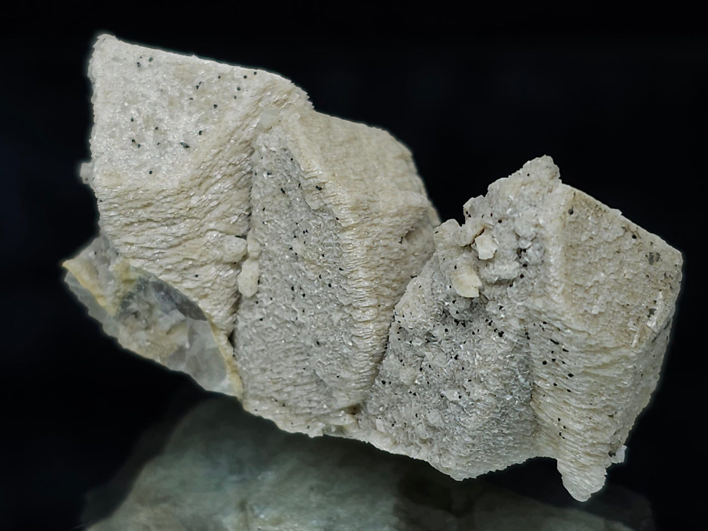 #88032 Hematite on cream-white Calcite pseudomorph after triple Combined form Calcite