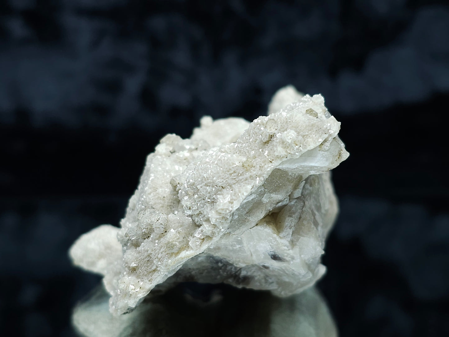 #88078 White Calcite, heavily striated, complex rhombohedral-scalenohedral ( pseudomorph ) after rare Combined form Calcite on matrix