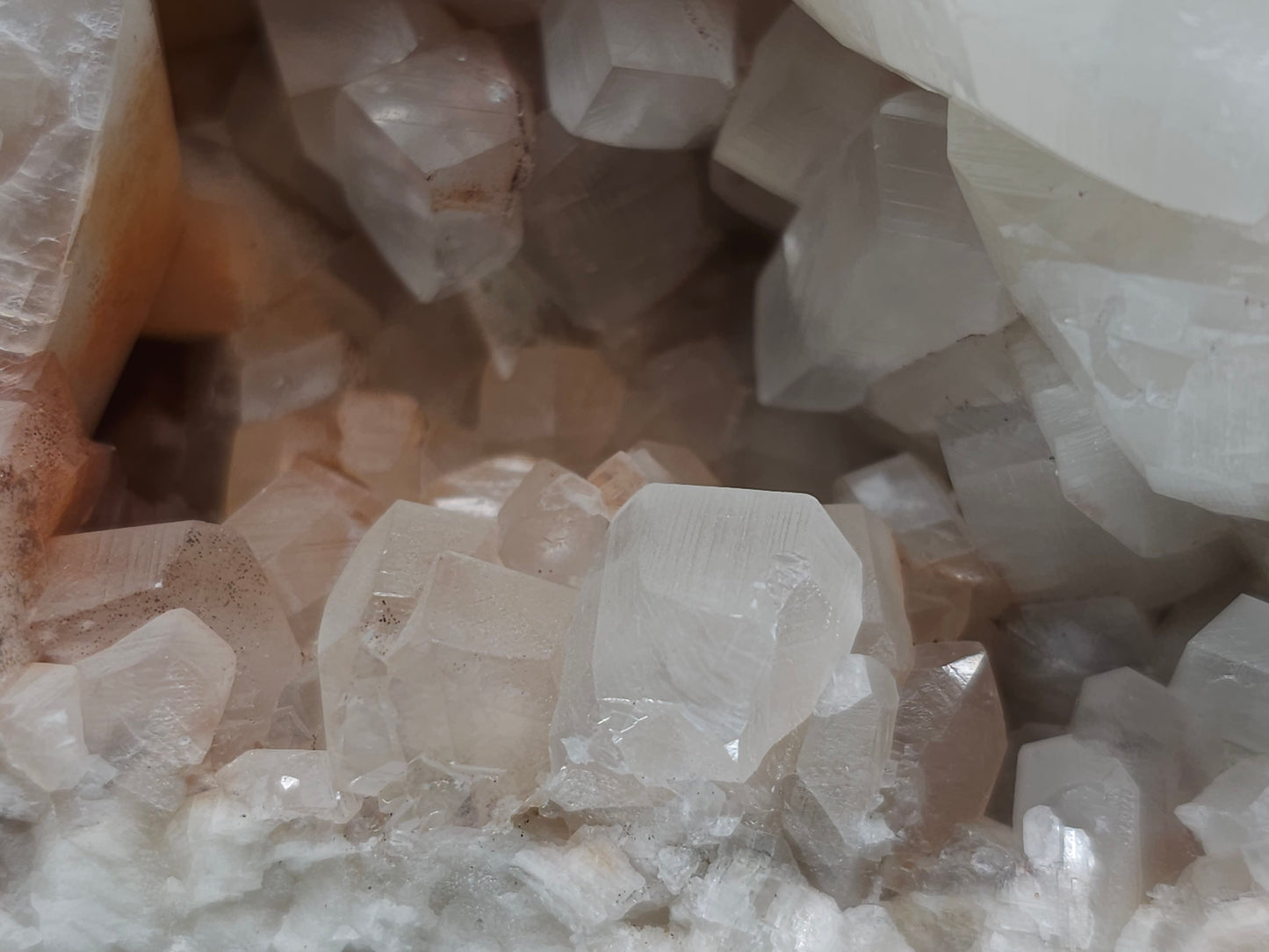 #11072 White and clear Combined form Calcite with Hematite inclusions on matrix