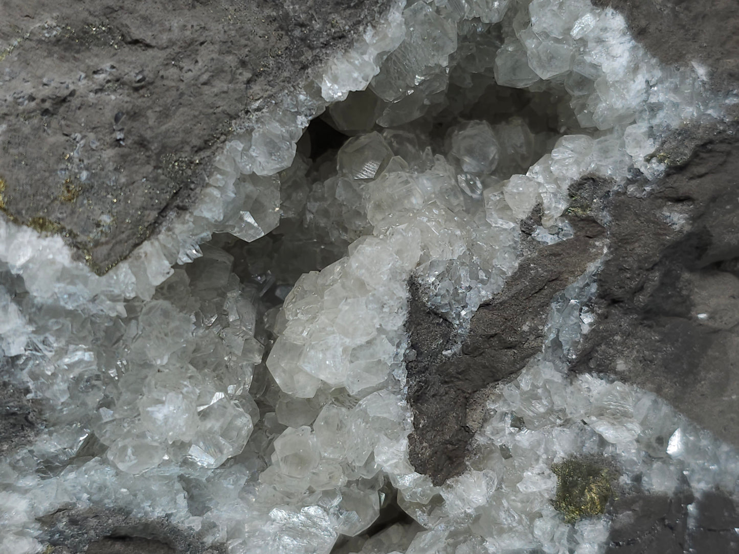 #33137 Super clear Nailhead Spar Calcite geode with Chalcopyrite ore and multiple small fossils in the matrix