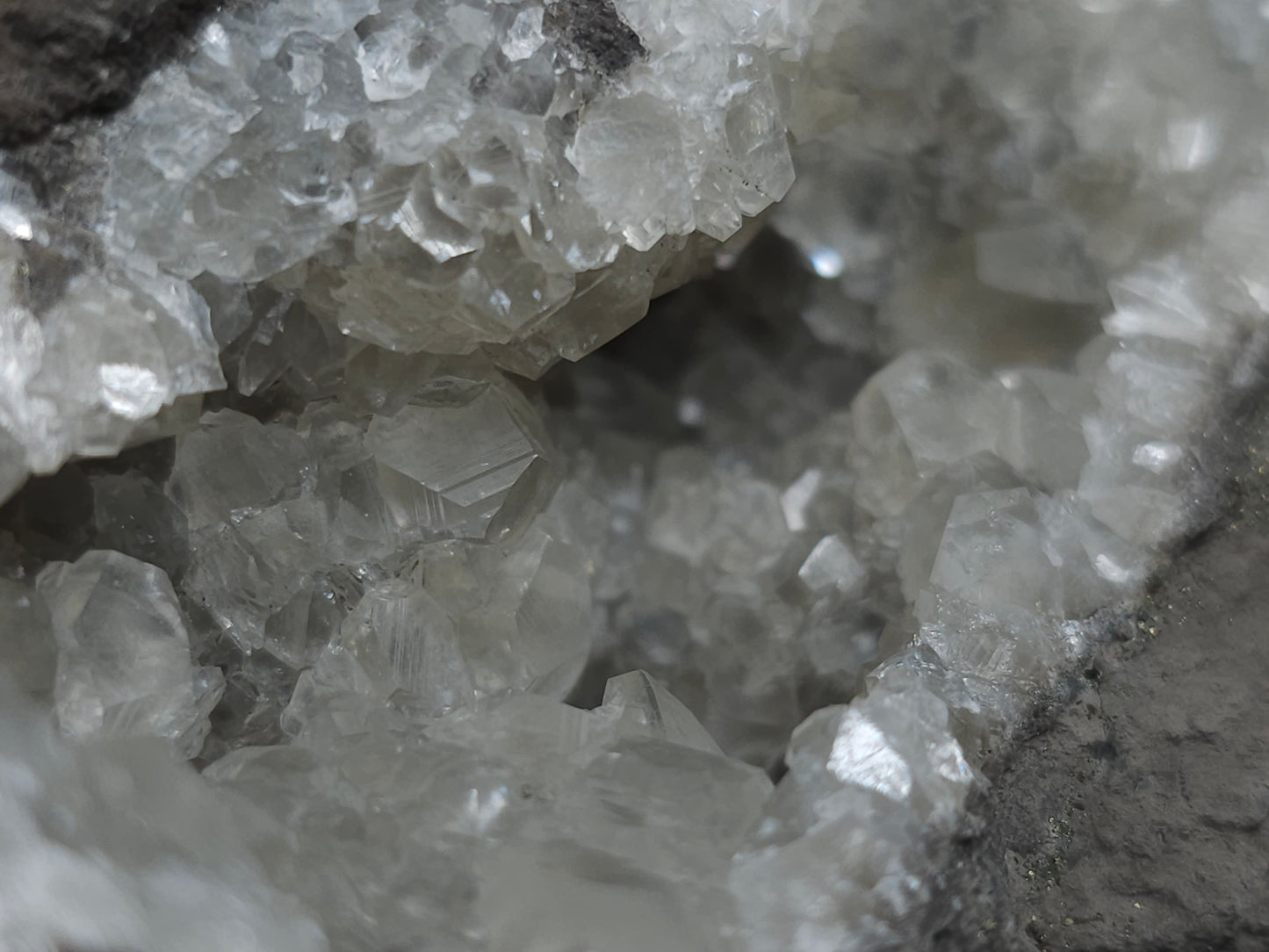 #33137 Super clear Nailhead Spar Calcite geode with Chalcopyrite ore and multiple small fossils in the matrix