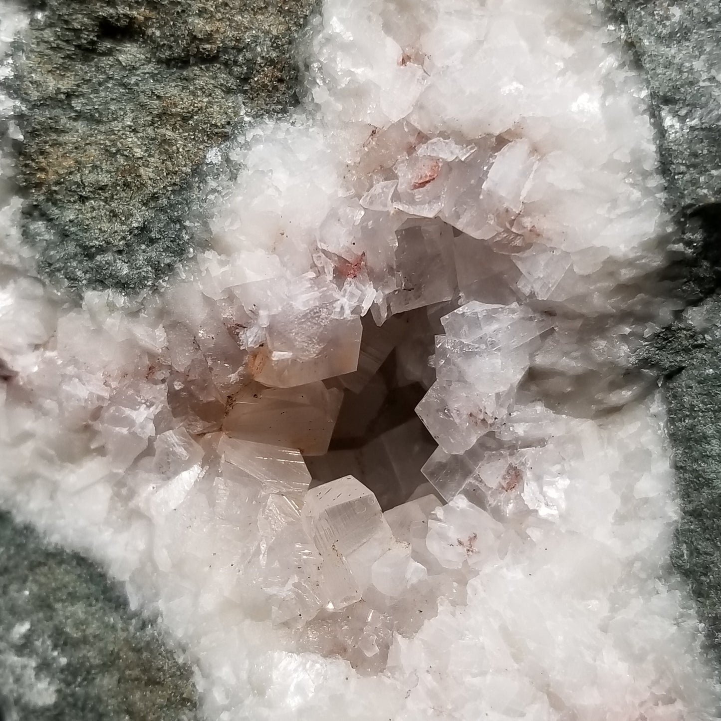 #11286 Chalcopyrite on clear Combined form Calcite with Hematite inclusions