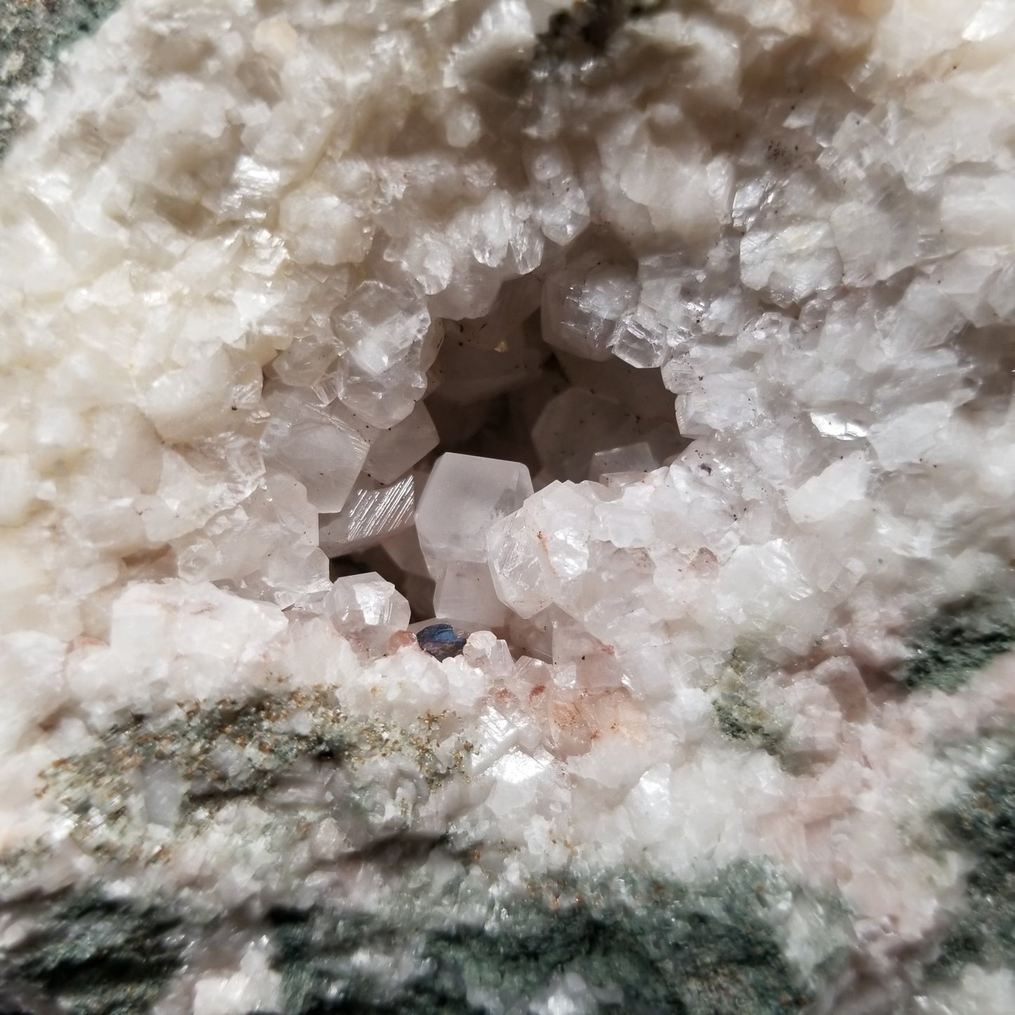 #11299 Chalcopyrite on clear Combined form Calcite with Hematite inclusions