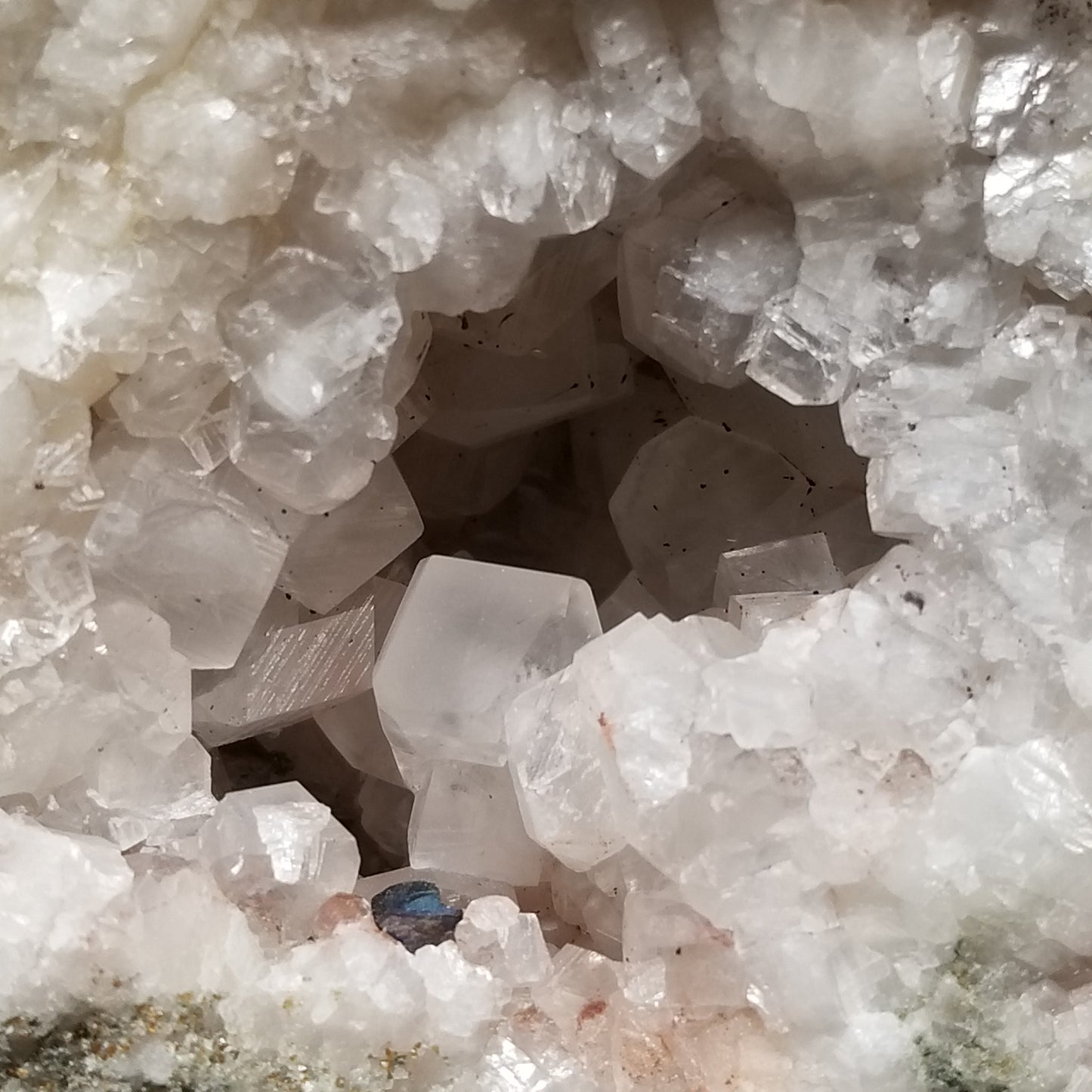 #11299 Chalcopyrite on clear Combined form Calcite with Hematite inclusions