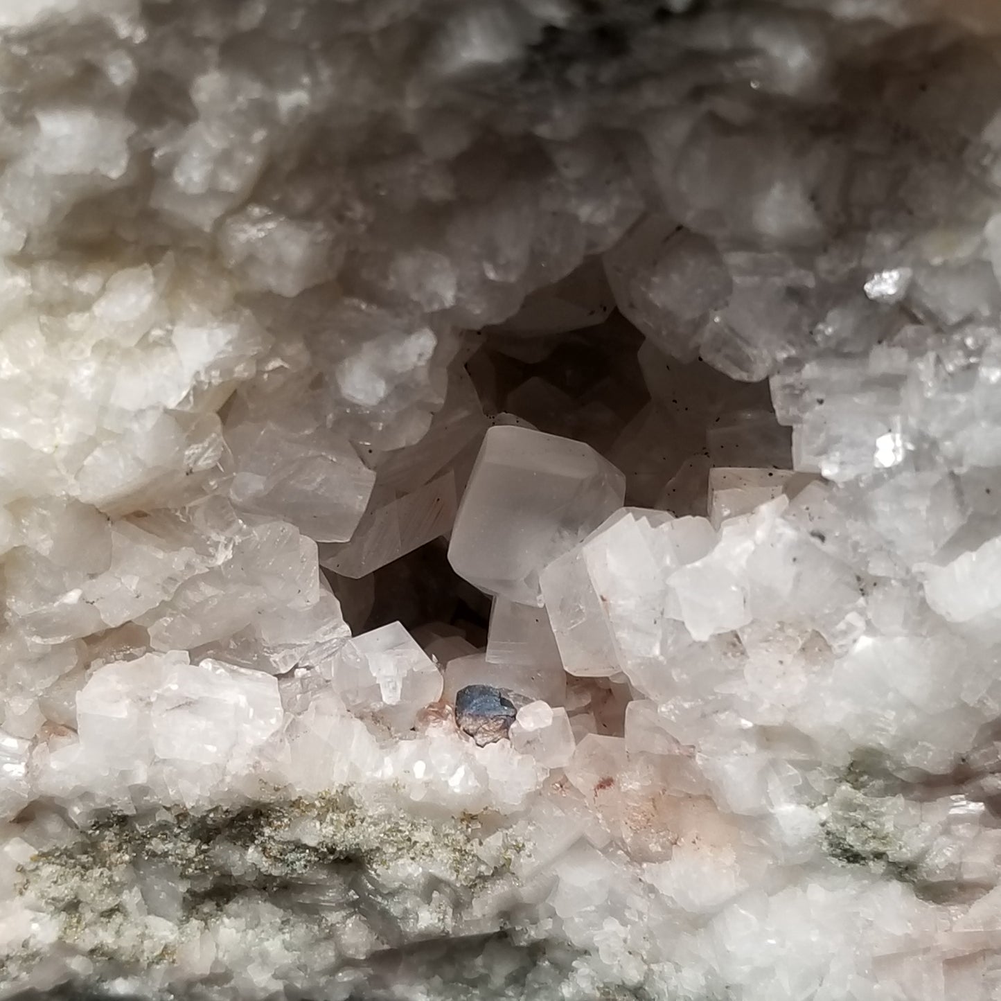 #11299 Chalcopyrite on clear Combined form Calcite with Hematite inclusions