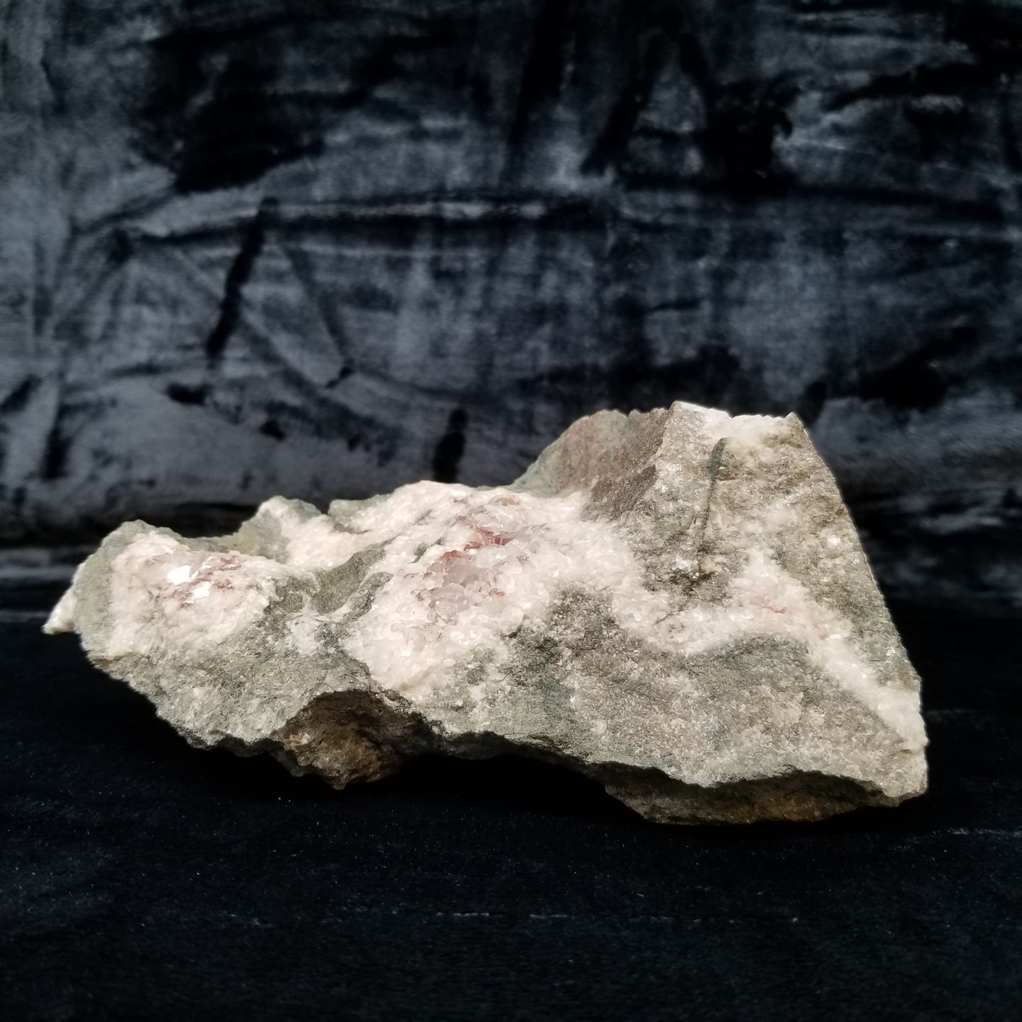 #11299 Chalcopyrite on clear Combined form Calcite with Hematite inclusions