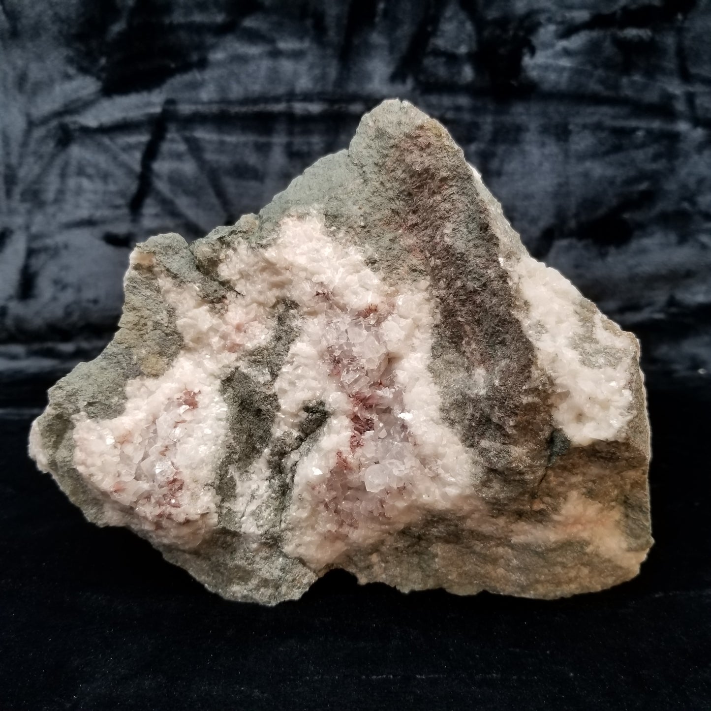 #11299 Chalcopyrite on clear Combined form Calcite with Hematite inclusions