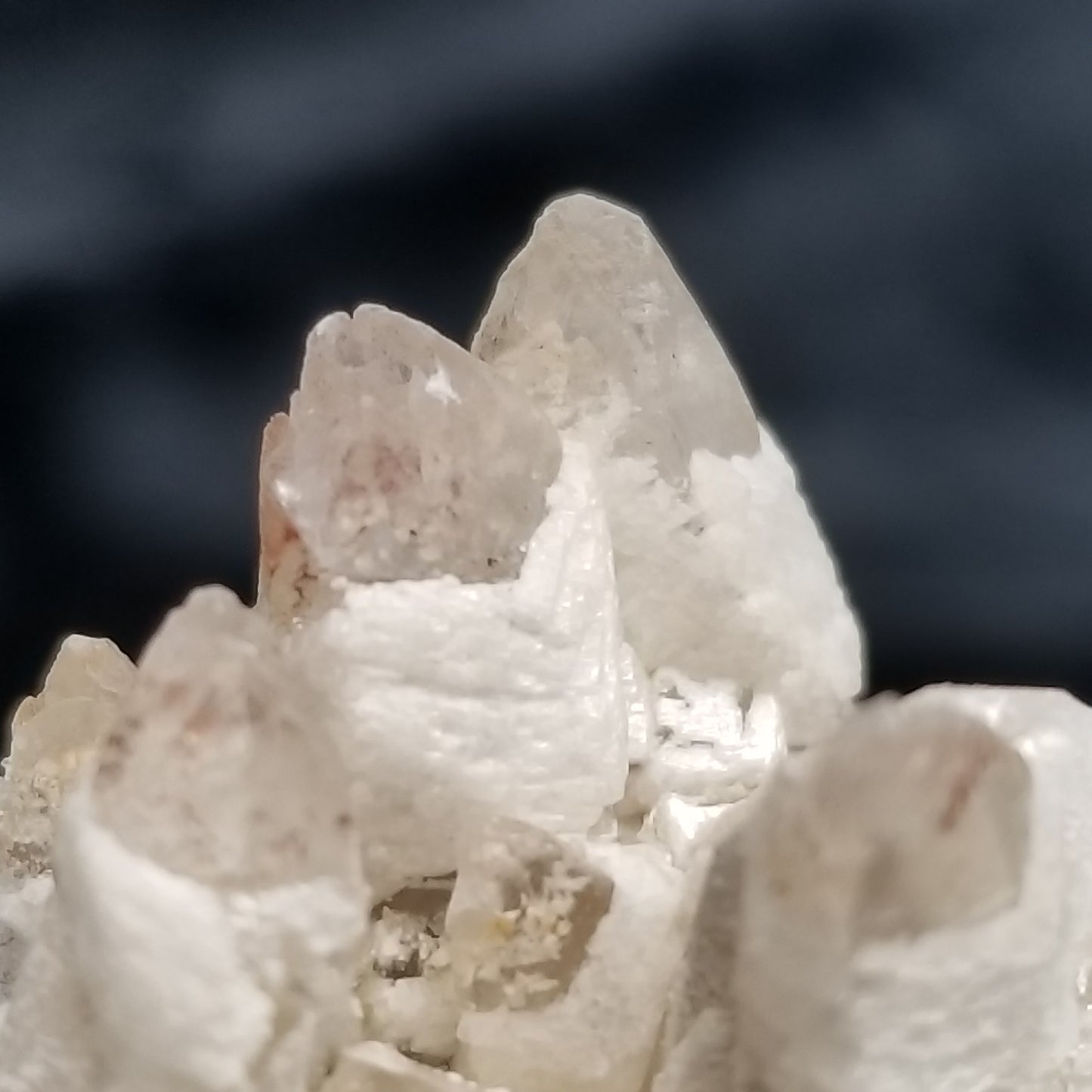 #11348 White Dolomite and Chalcopyrite on clear Combined form Calcite cluster with Hematite inclusions on matrix