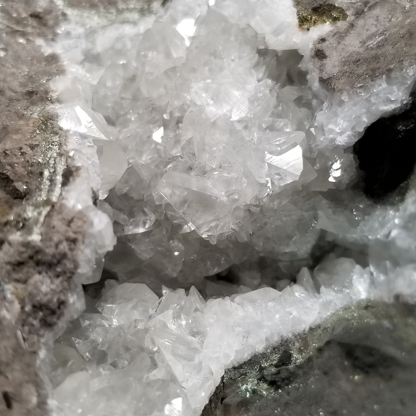 #33008 Super clear Nailhead Spar Calcite geode, Chalcopyrite ore and multiple small fossils in the matrix