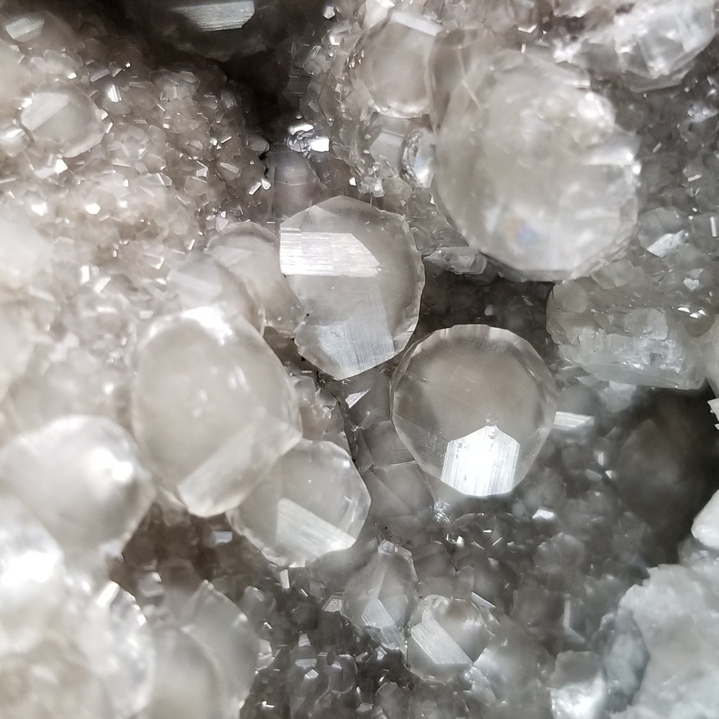 #33014 Super clear Nailhead Spar Calcite geode, Chalcopyrite ore and multiple small fossils in the matrix
