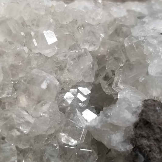 #33020 Super clear Nailhead Spar Calcite geode, Chalcopyrite ore and multiple small fossils in the matrix