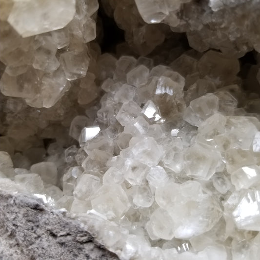 #33022 Super clear Nailhead Spar Calcite geode, Chalcopyrite ore and multiple small fossils in the matrix