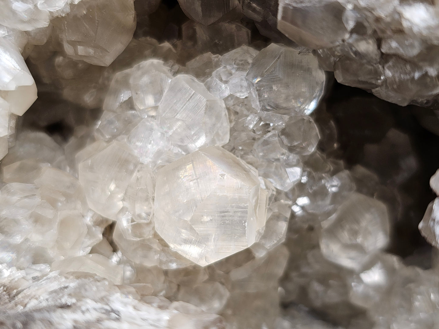 #33026 Super clear Nailhead Spar Calcite geode, Chalcopyrite ore and multiple small fossils in the matrix
