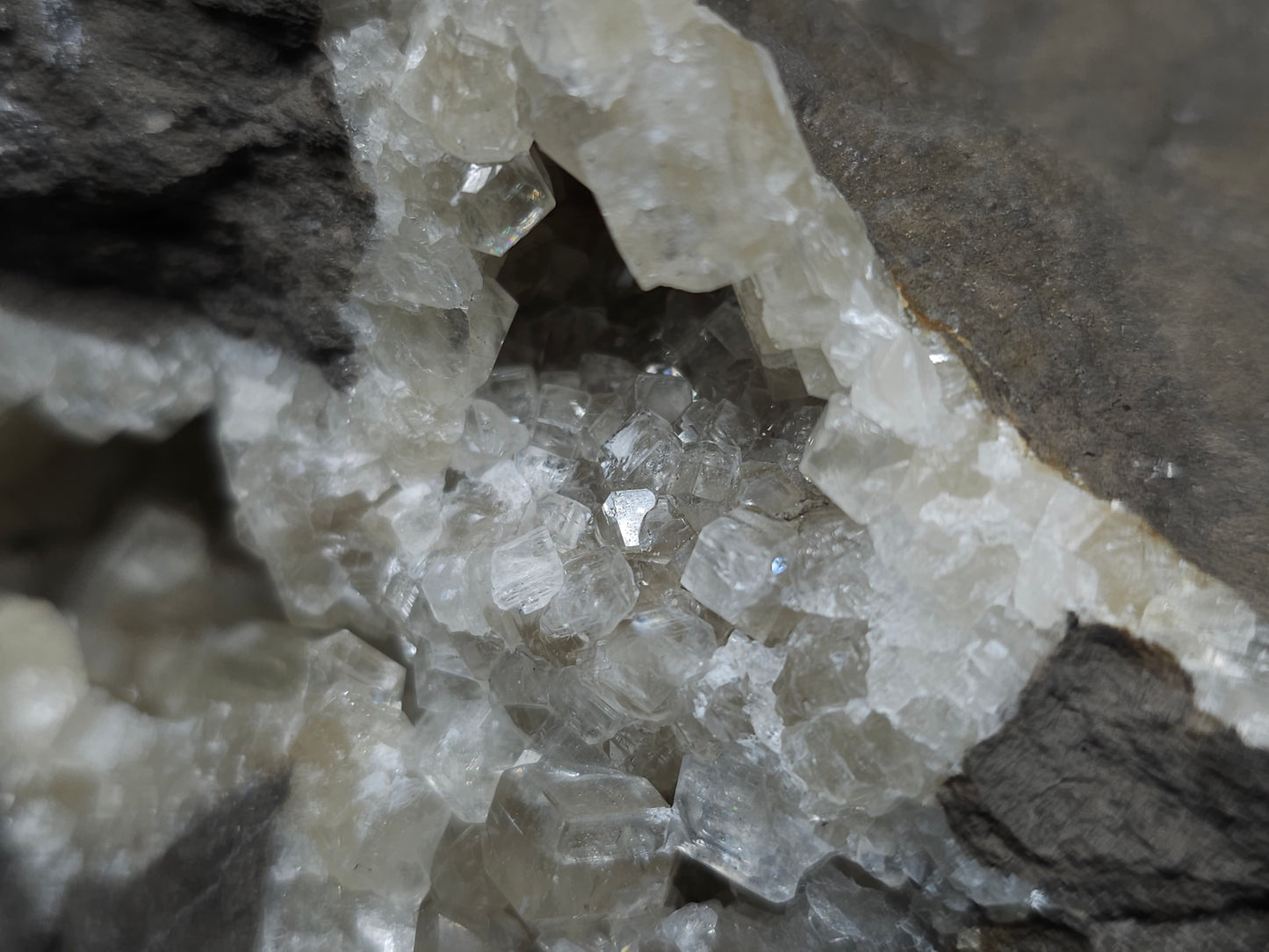 #33107 Super clear Nailhead Spar Calcite geode with Chalcopyrite ore and multiple small fossils in the matrix
