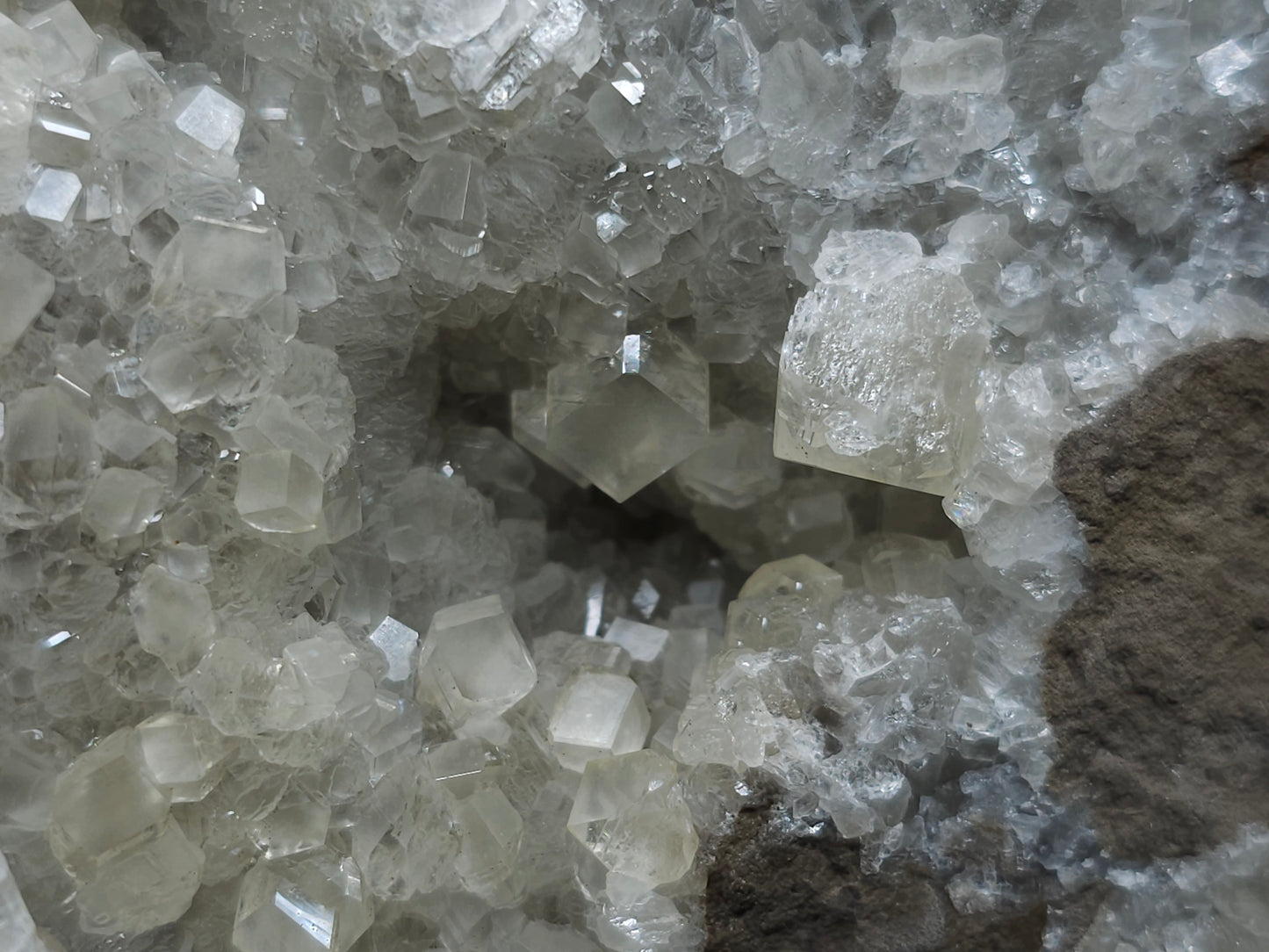 #33107 Super clear Nailhead Spar Calcite geode with Chalcopyrite ore and multiple small fossils in the matrix