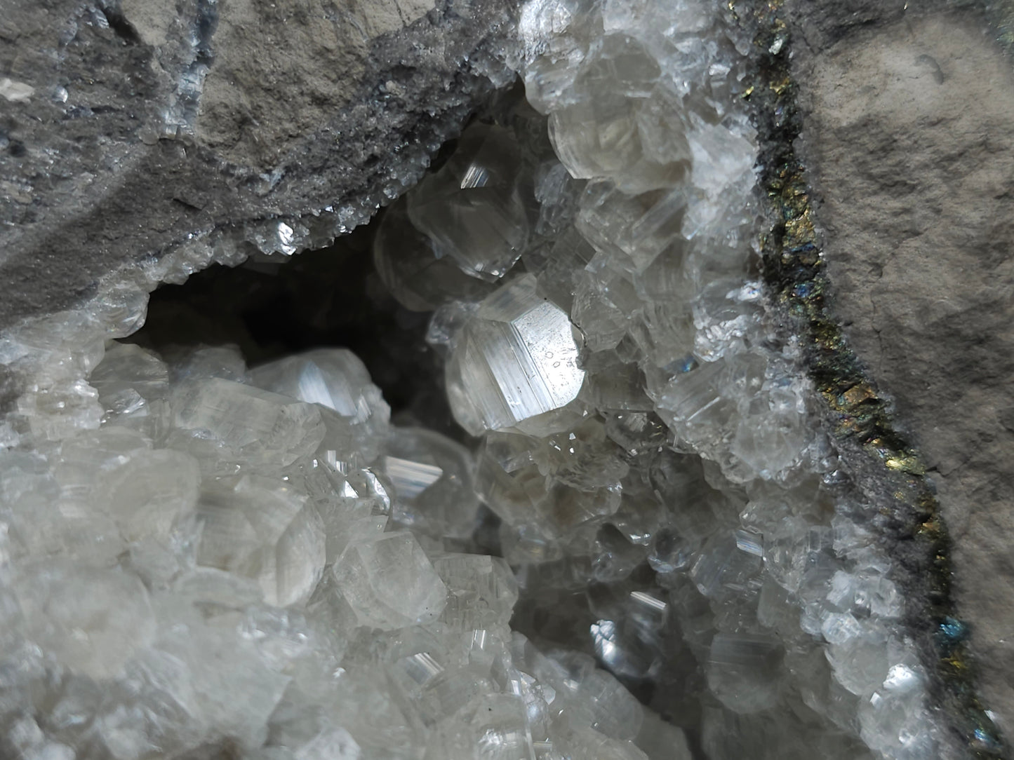 #33118 Super clear Nailhead Spar Calcite geode with Chalcopyrite ore and multiple small fossils in the matrix