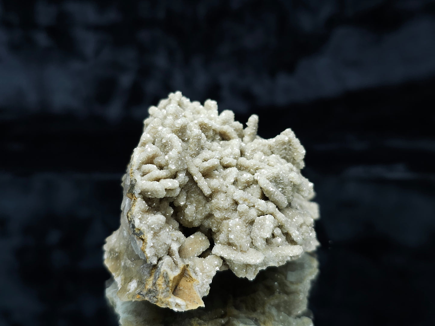 #88005 Cream-white Calcite pseudomorph after needle Calcite on matrix