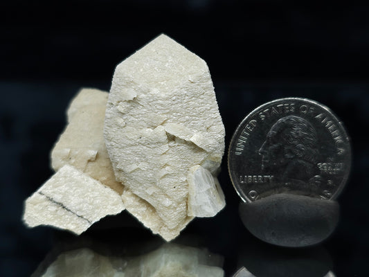 #88028 Hematite on cream-white Calcite pseudomorph after twin Combined form Calcite