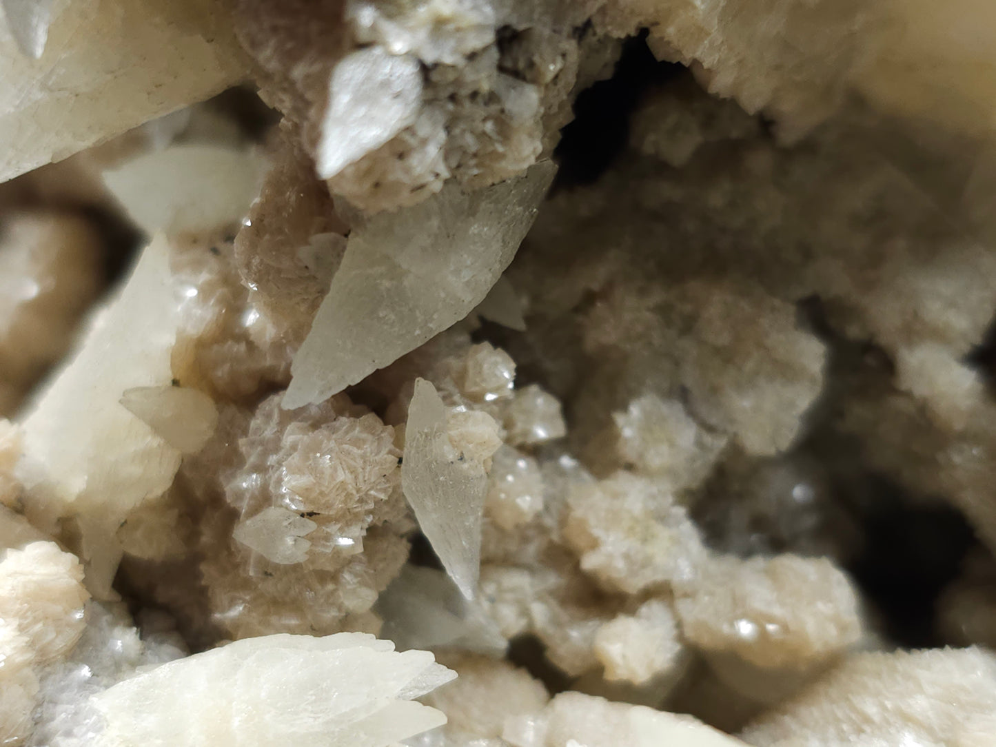 #10030 Hematite and Dogtooth Spar Calcite on white Calcite pseudomorph after Calcite formation