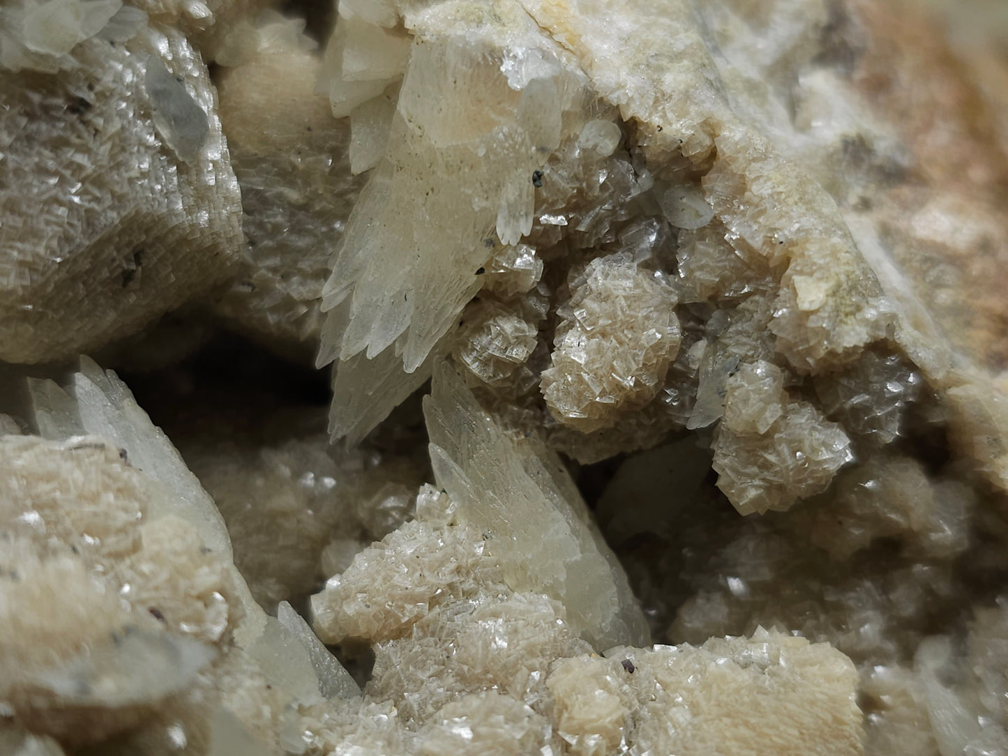 #10030 Hematite and Dogtooth Spar Calcite on white Calcite pseudomorph after Calcite formation