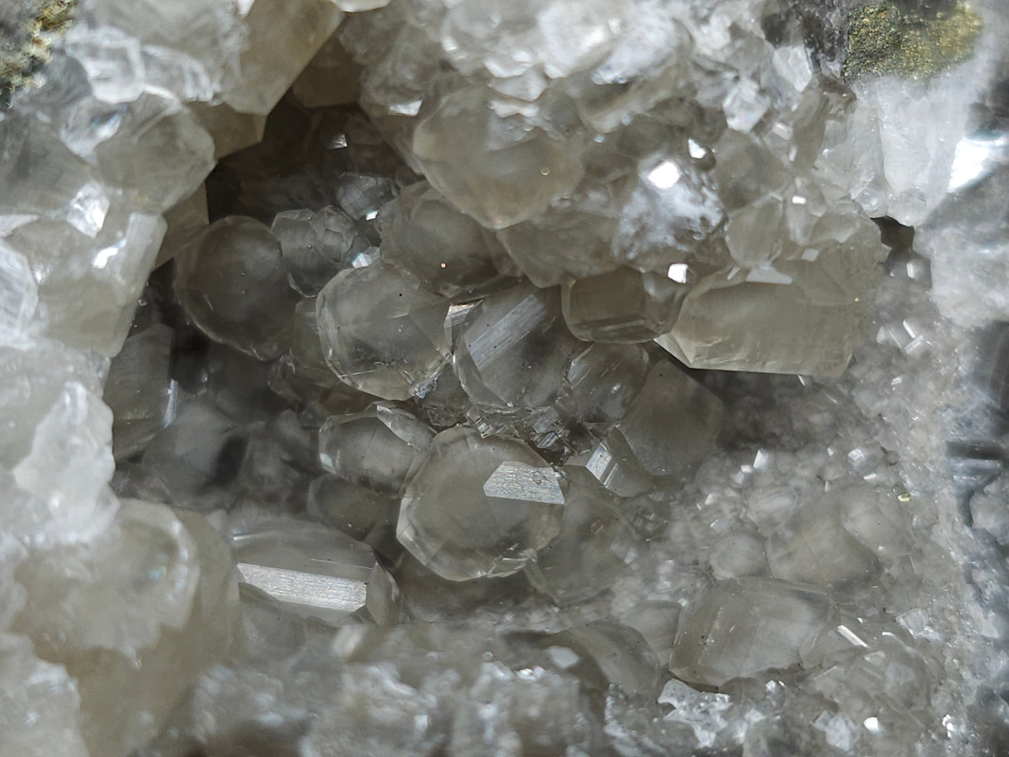 #33145 Super clear Nailhead Spar Calcite geode with Chalcopyrite ore and multiple small fossils in the matrix