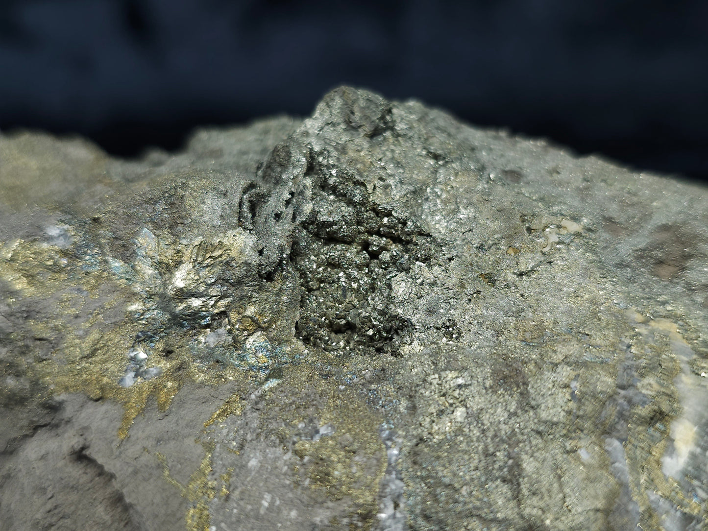 #66002 Hydrothermal mineral deposit that have fossil flower with peacock Chalcopyrite ore coating with small Dogthoot Spar Calcite and multiple fossil