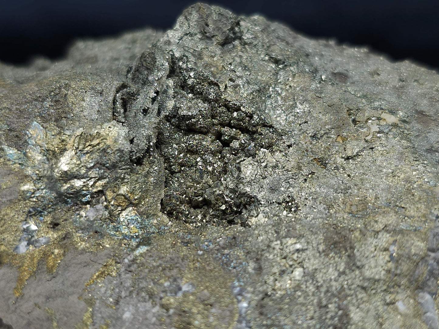 #66002 Hydrothermal mineral deposit that have fossil flower with peacock Chalcopyrite ore coating with small Dogthoot Spar Calcite and multiple fossil