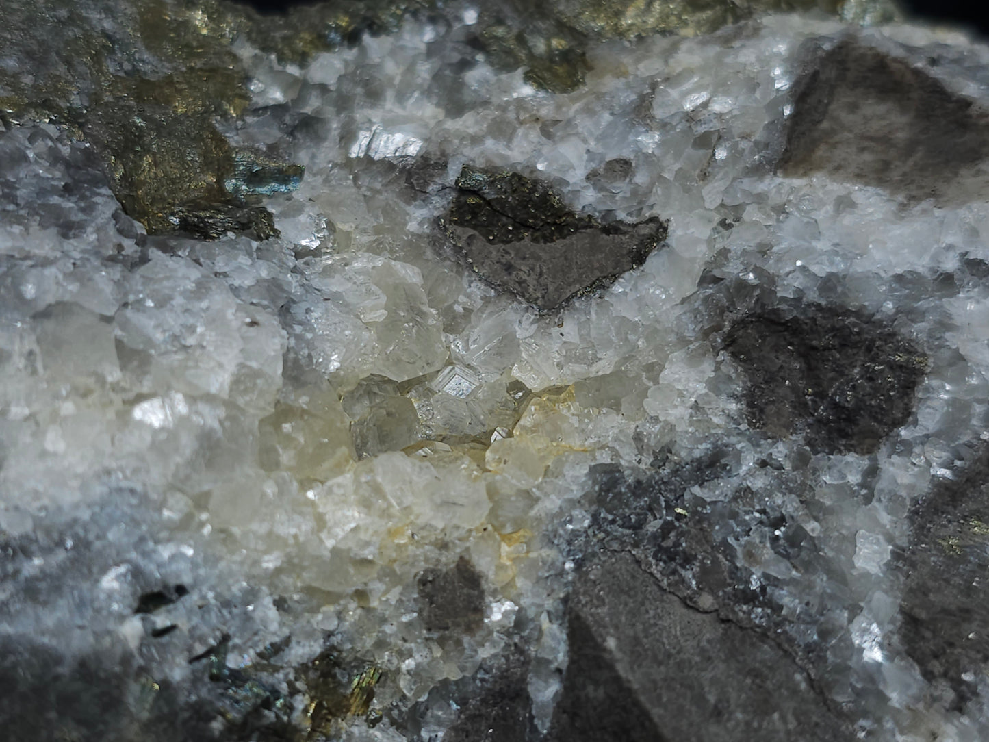 #66025 Hydrothermal mineral deposit that have peacock Chalcopyrite ore also with some wonderful small Nailhead Spar Calcite formation and it have multiple fossils