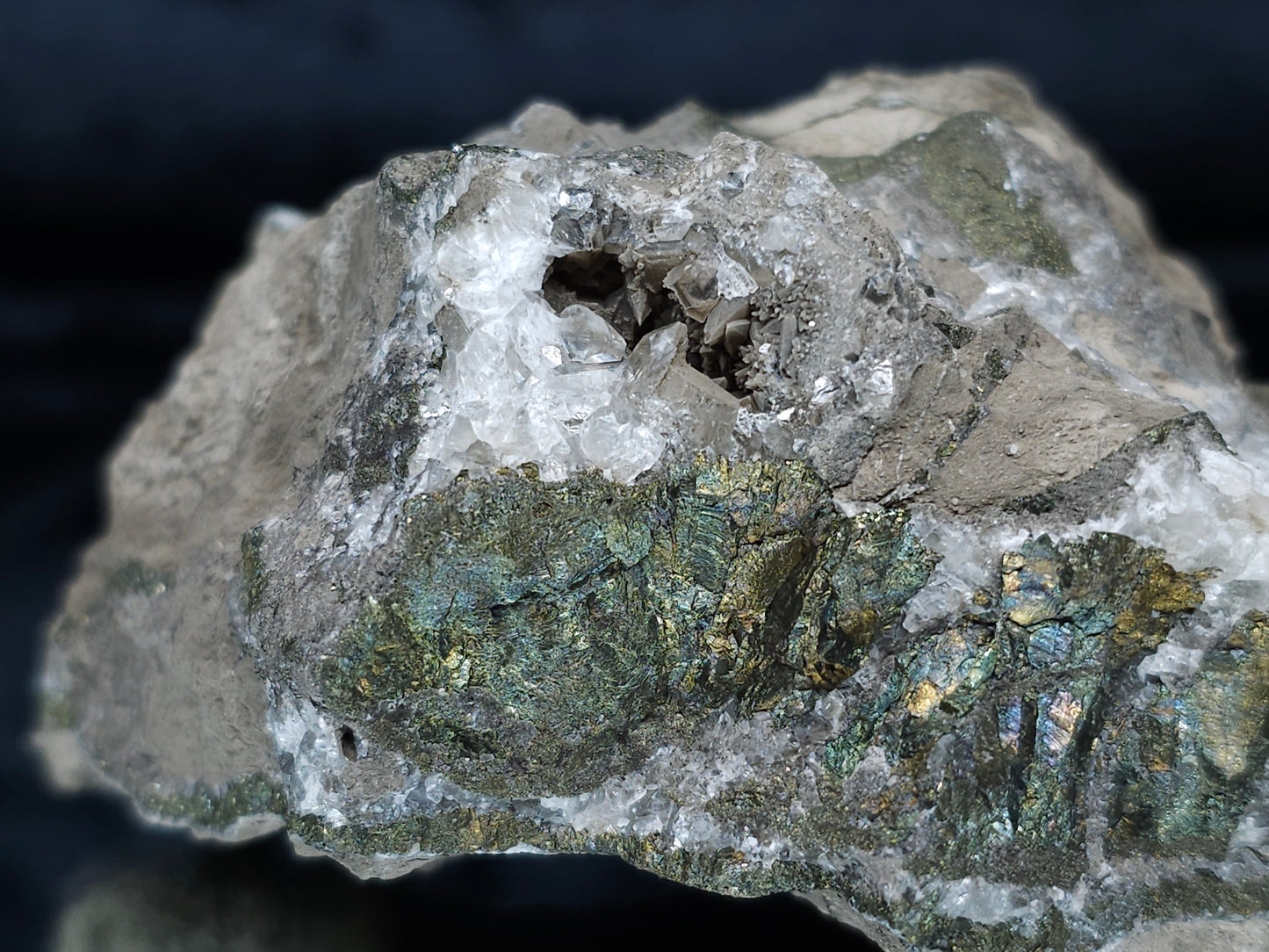 #66027 Hydrothermal mineral deposit that have peacock Chalcopyrite ore with small Dogtooth Spar Calcite geode and multiple fossils