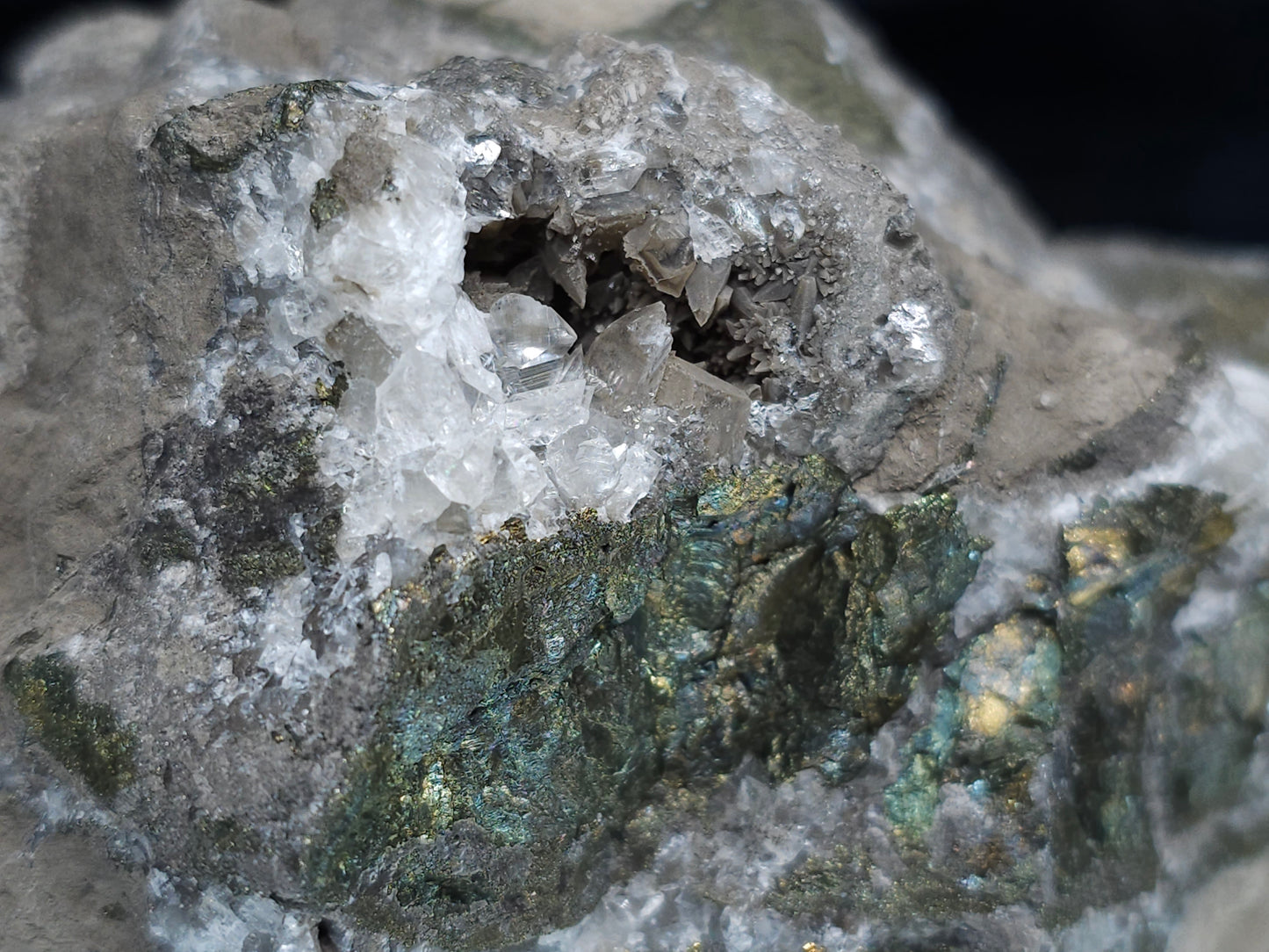 #66027 Hydrothermal mineral deposit that have peacock Chalcopyrite ore with small Dogtooth Spar Calcite geode and multiple fossils