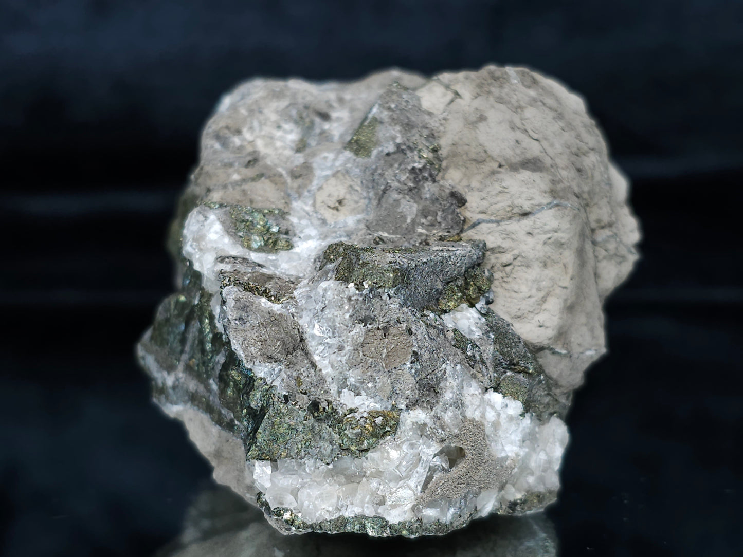 #66027 Hydrothermal mineral deposit that have peacock Chalcopyrite ore with small Dogtooth Spar Calcite geode and multiple fossils