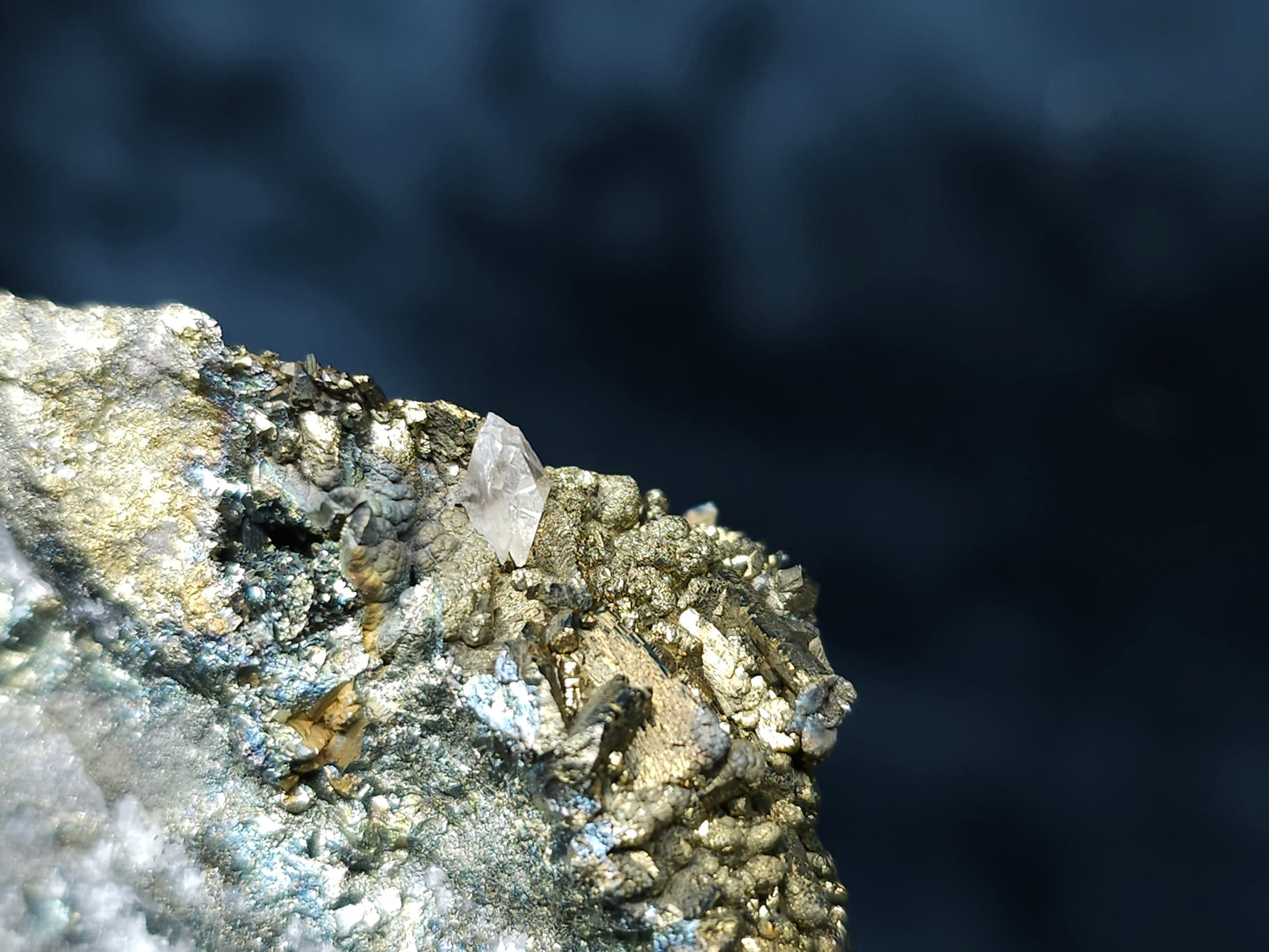 #66038 Iridescent Chalcopyrite with Marcasite formation, it also have beautiful lines of calcite with multiple fossils