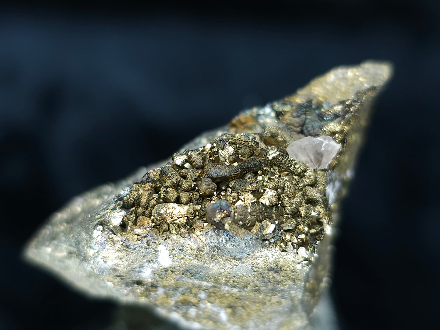 #66038 Iridescent Chalcopyrite with Marcasite formation, it also have beautiful lines of calcite with multiple fossils