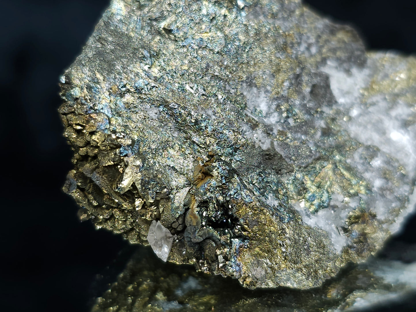 #66038 Iridescent Chalcopyrite with Marcasite formation, it also have beautiful lines of calcite with multiple fossils