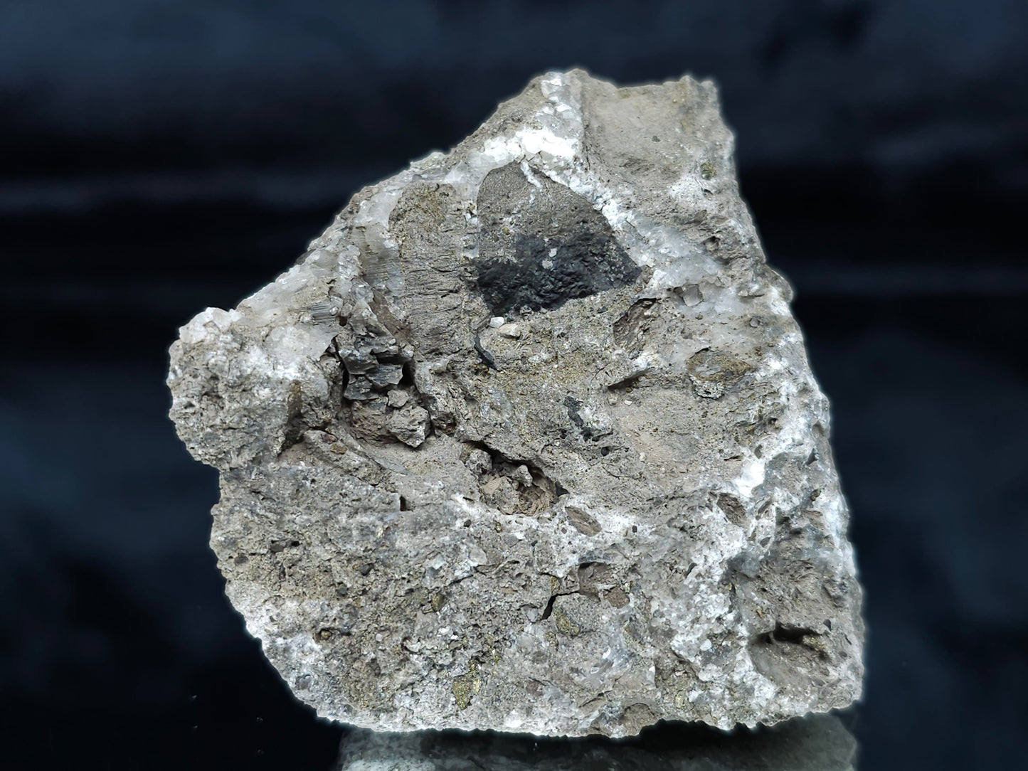 #66110 Iridescent Chalcopyrite ore with hydrothermal Chalcopyrite and Calcite deposit trought multiple small fossils