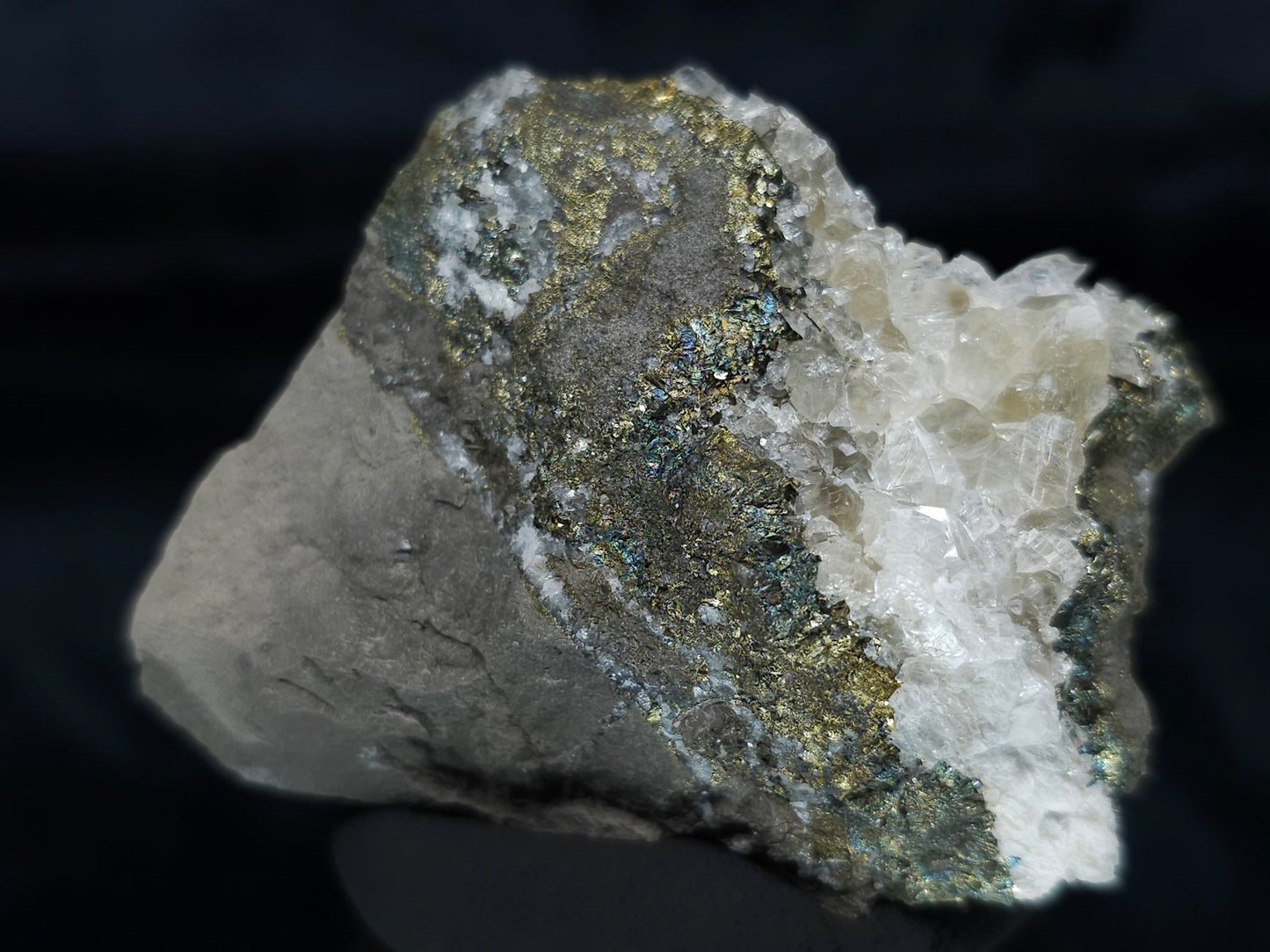 #66116 Iridescent peacock Chalcopyrite ore, hydrothermal Calcite deposit with multiple small fossils