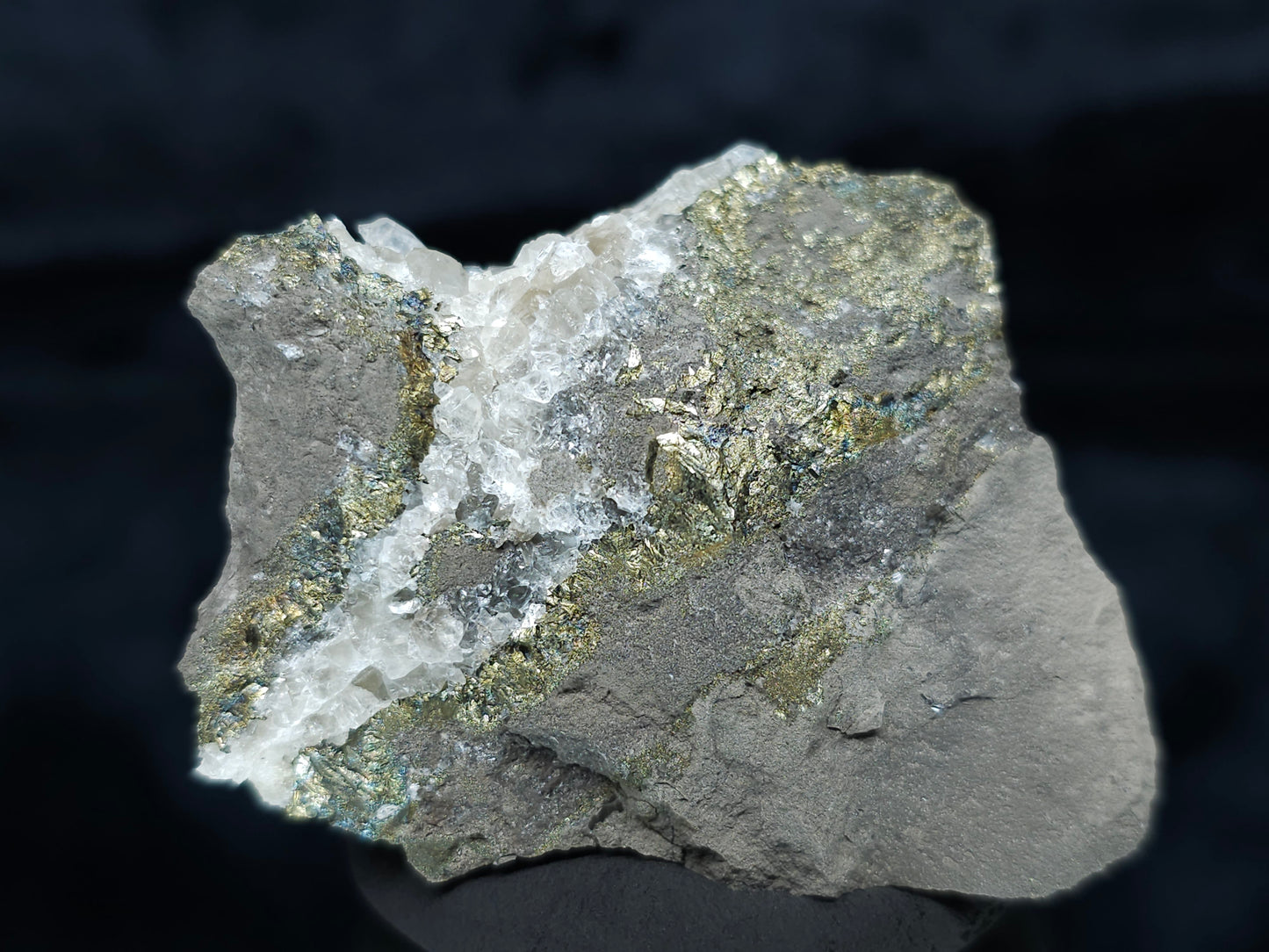 #66116 Iridescent peacock Chalcopyrite ore, hydrothermal Calcite deposit with multiple small fossils