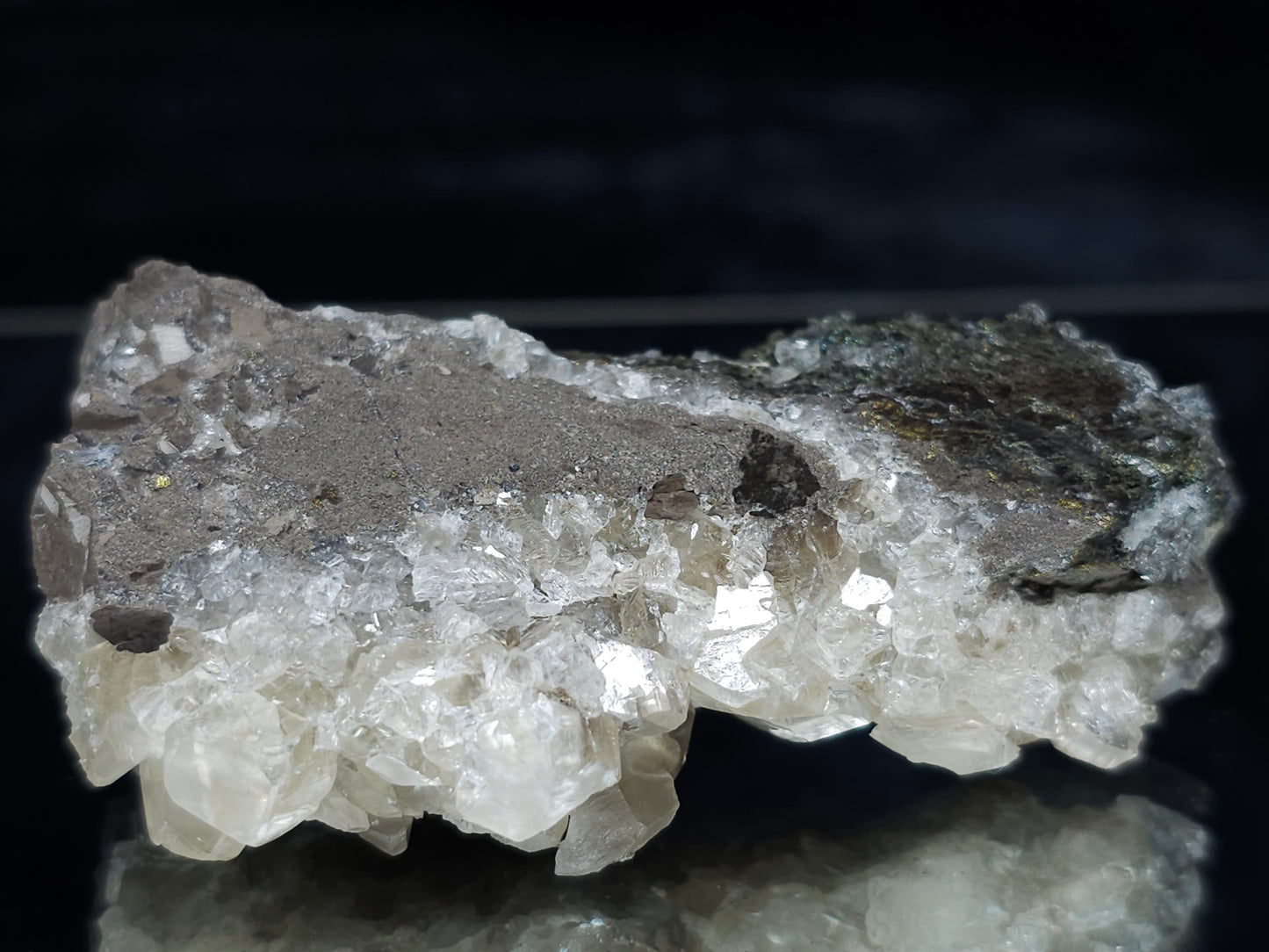 #66117 Nailhead Spar Calcite on peacock Chalcopyrite ore among fossil flower with Chalcopyrite coating water clear Nailhead Spar Calcite formation on multiple small fossils